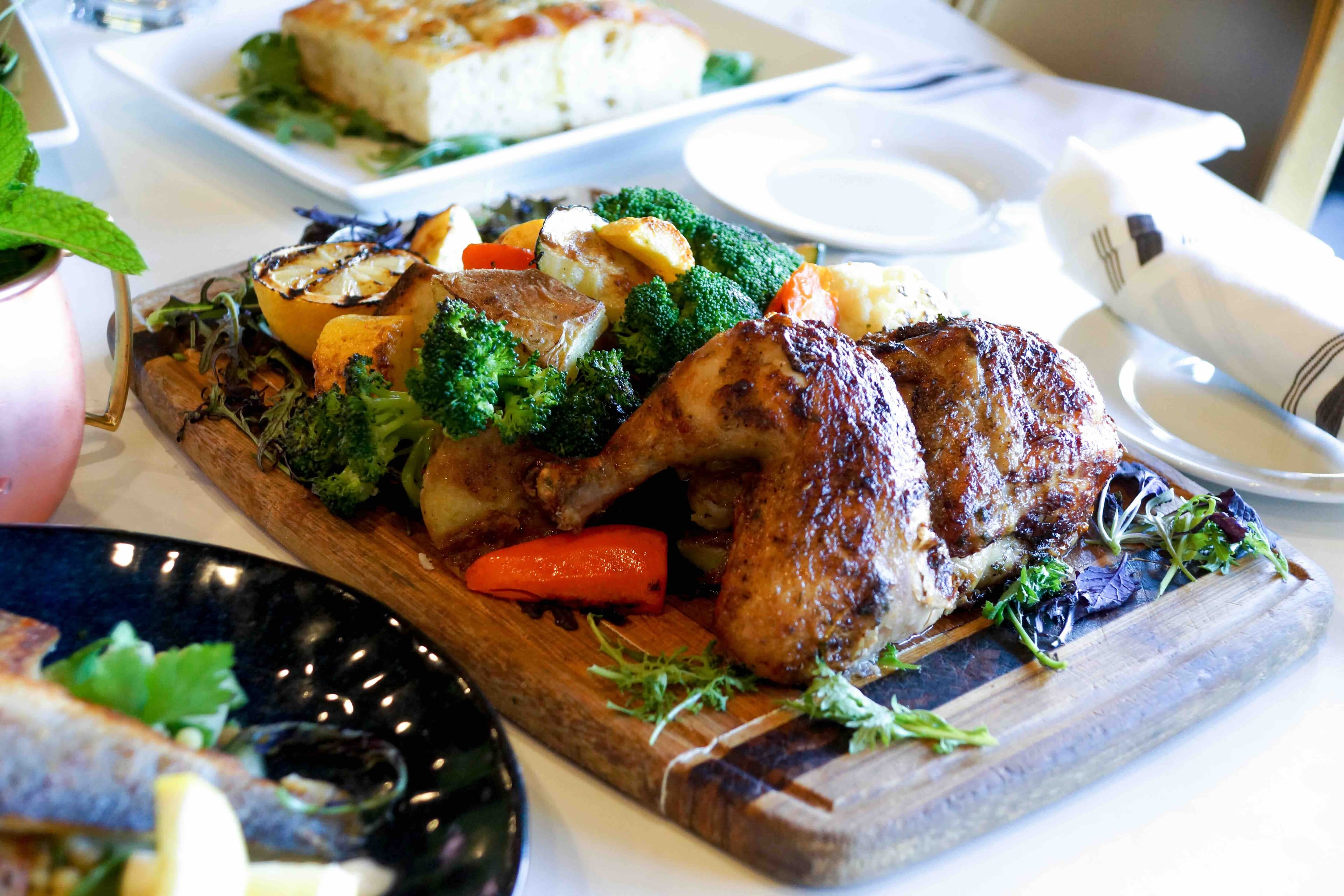 RoVino wood-fired chicken board with roasted vegetables.